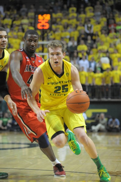 EJ Singler drives the lane against the Arizona Wildcats at Matthew Knight Arena. Singler described beating the 'Cats at the "Biggest win of my career." (Photo by Rockne Andrew Roll) 