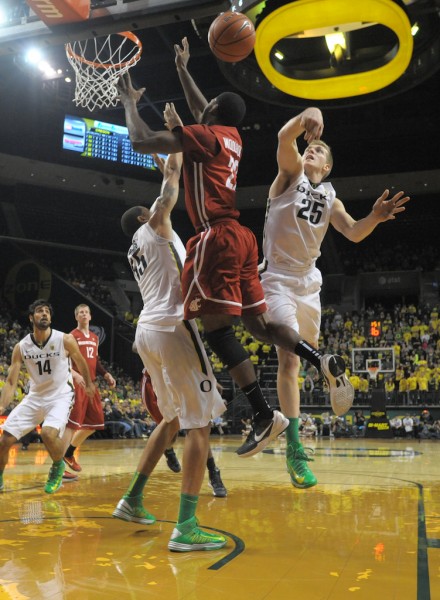 E.J. Singler was all over the court in the Ducks comeback win over Washington State, including notching this block in the first half. (Photo by Rockne Andrew Roll)