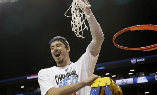 Saint Louis' Cody Ellis reacts after cutting a piece of the net after an NCAA college basketball game against Virginia Commonwealth and winning the championships of the Atlantic 10 Conference tournament. (AP)