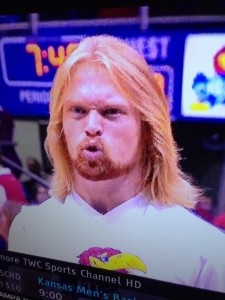 KU's cheer squad member challenges the WVU Mountaineer for best beard in the Big 12.
