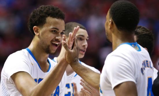 Kyle Anderson (left), Zach LaVine, and Norman Powell had a lot to celebrate about as the Bruins easily advanced to the Sweet 16. (AP)