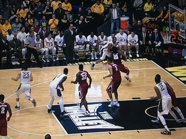 The double team doesn't come in the man to man and Cotton is able to drive past the defender. 