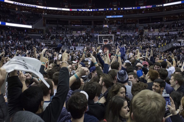 Students celebrate after Georgetown routed Villanova for first place in the Big East.