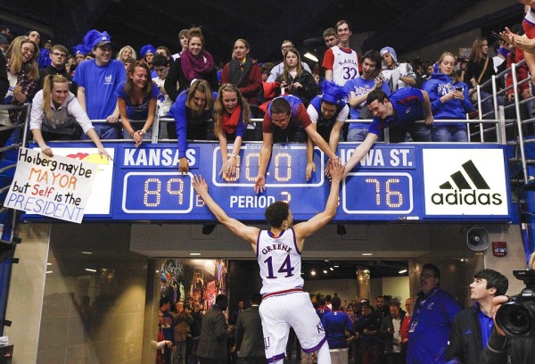 Brannen Greene celebrates with fans after the Jayhawks' win over Iowa State. (Nick Krug/KU Sports)