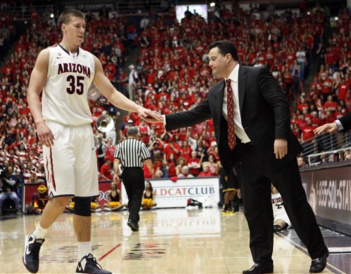 Even minus four of last year's starters, expect Arizona to have a say in the conference race (AP Photo/Wily Low)