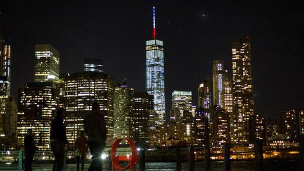 Cities all around the world showed their support for Paris and France in varying ways since Friday - including New York City. (AP)