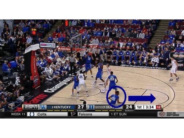 A little role reversal as 6'3" guard Isaiah Briscoe grabs the rebound and 6'9" Marcus Lee releases on the fast break. 